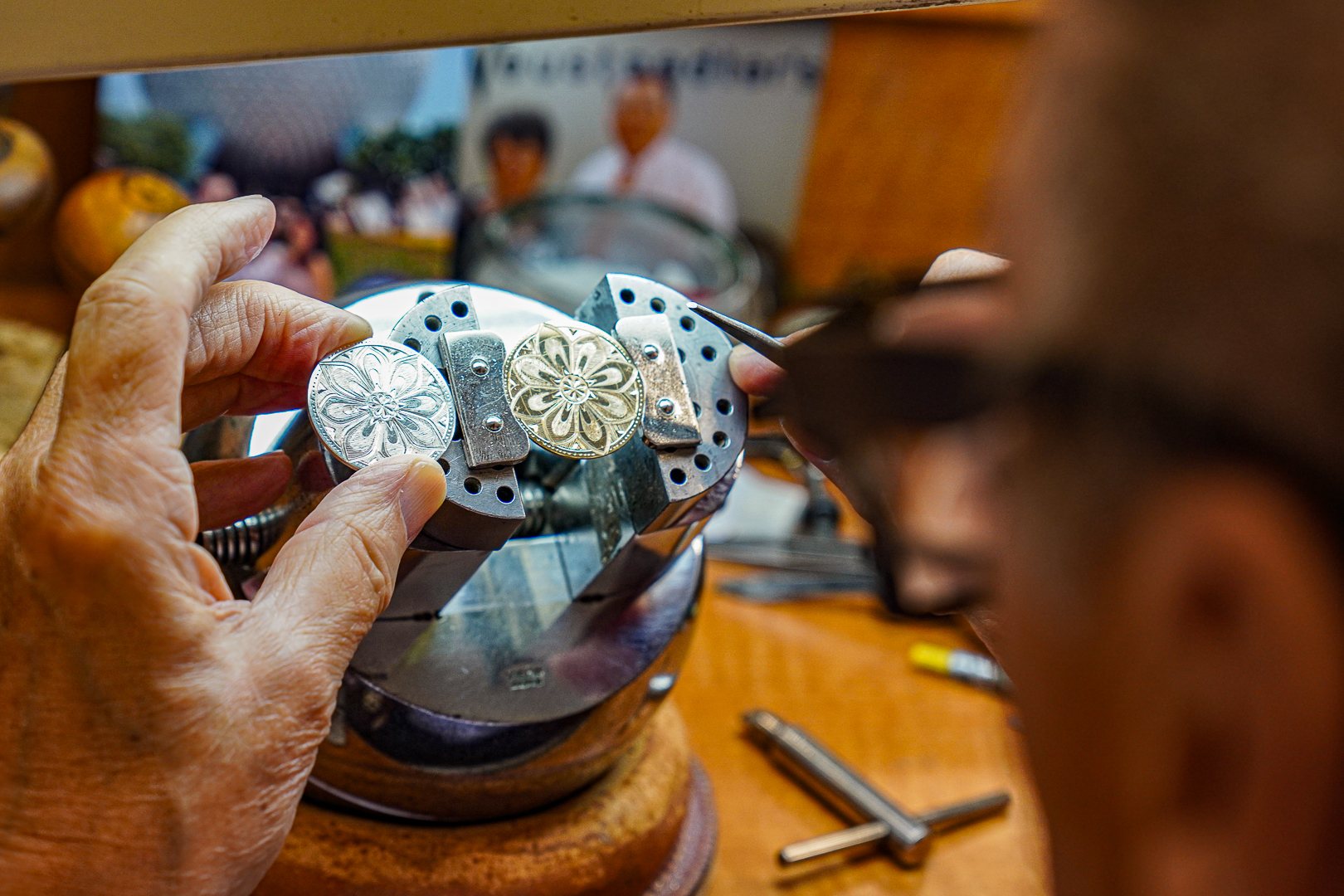 Jeweler’s workbench with specialized tools, pliers, files, and equipment used for jewelry repair and crafting.